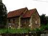 Biserica medievală din Sânpetru, vedere dinspre cimitir și de peste gard